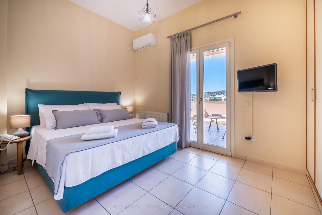Un pat sau paturi într-o cameră la Ελαιών apartments/Eleon apartments