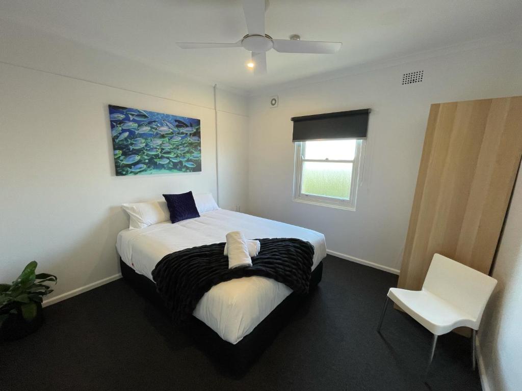 Postel nebo postele na pokoji v ubytování Plantation Hotel Coffs Harbour