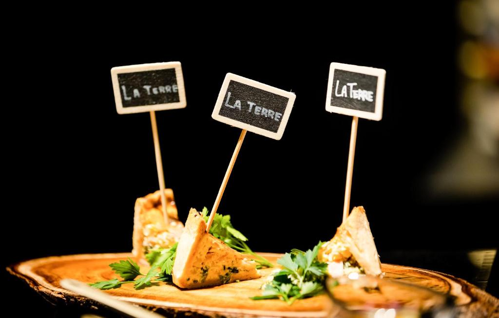 a plate of food with signs that say left at Cross Hotel Osaka in Osaka
