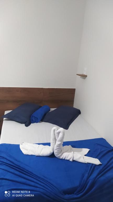 Postel nebo postele na pokoji v ubytování Pousada Quarto com frigobar,ar e garagem gratuita