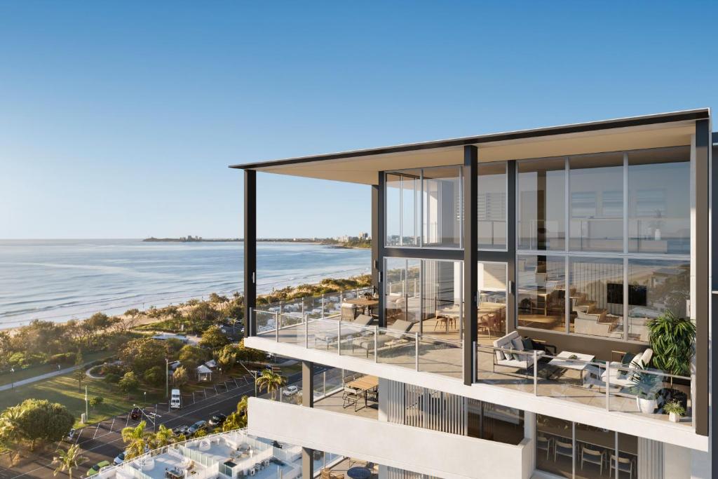 an aerial view of a building with the ocean in the background at Rise Maroochydore in Maroochydore