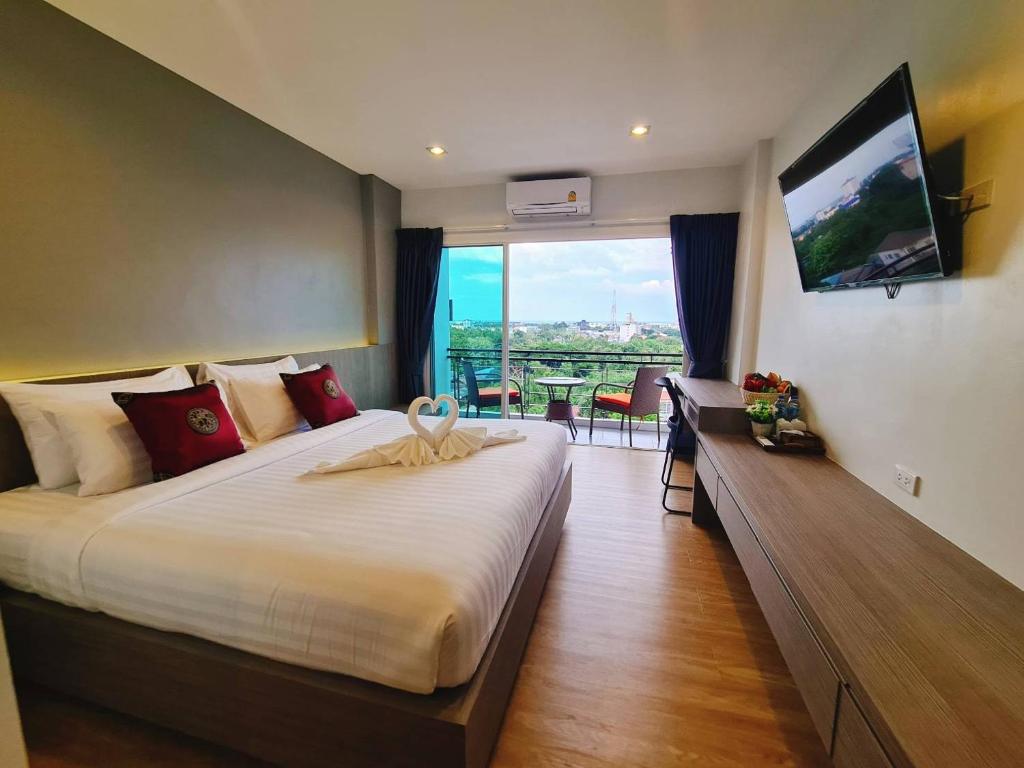 Postel nebo postele na pokoji v ubytování UR The Private Huahin