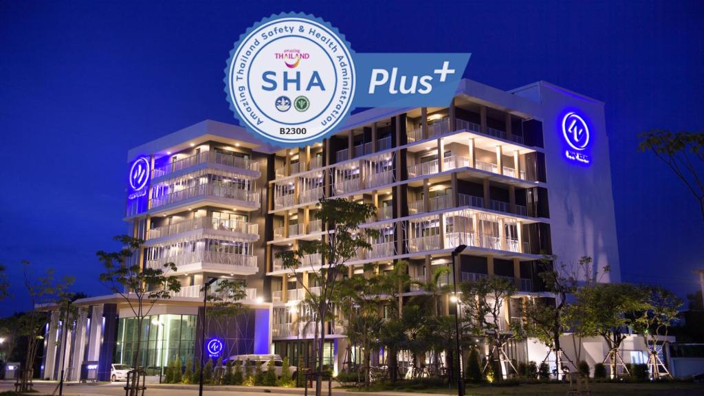 a building with a sign that reads shka plus at NAP KRABI HOTEL - SHA Extra Plus in Krabi