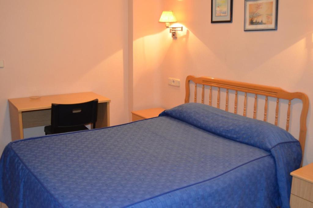 Postel nebo postele na pokoji v ubytování Hotel Legazpi