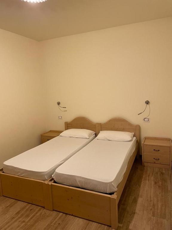 Postel nebo postele na pokoji v ubytování Residence Elettra
