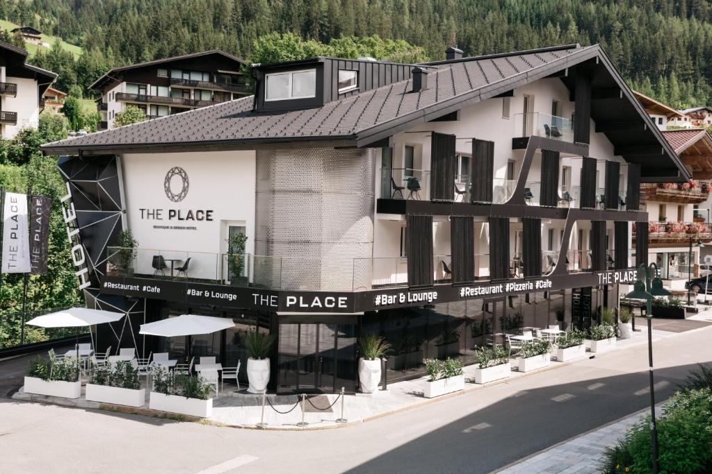 a building in the middle of a street at The Place Boutique & Design Hotel Flachau in Flachau