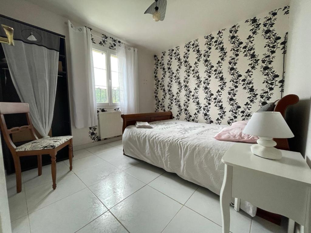 Postel nebo postele na pokoji v ubytování Chambre d'hôte