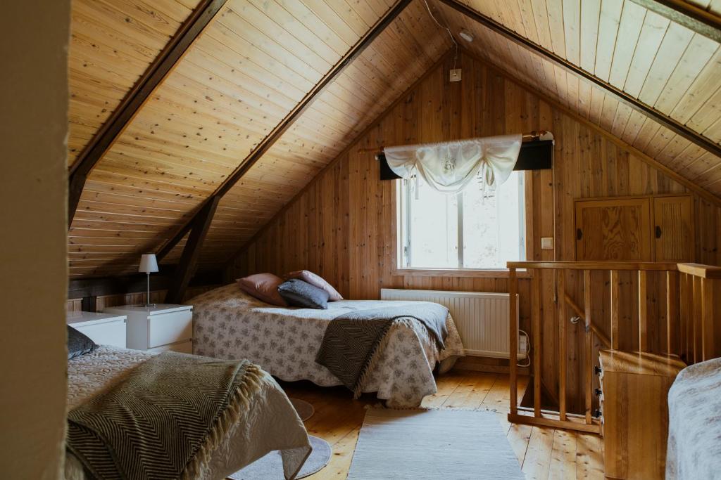 Postel nebo postele na pokoji v ubytování Kylås Vildmark