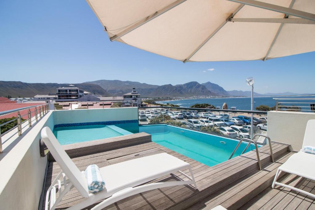 a swimming pool on the roof of a building at Harbour House Hotel - Harbour Square in Hermanus