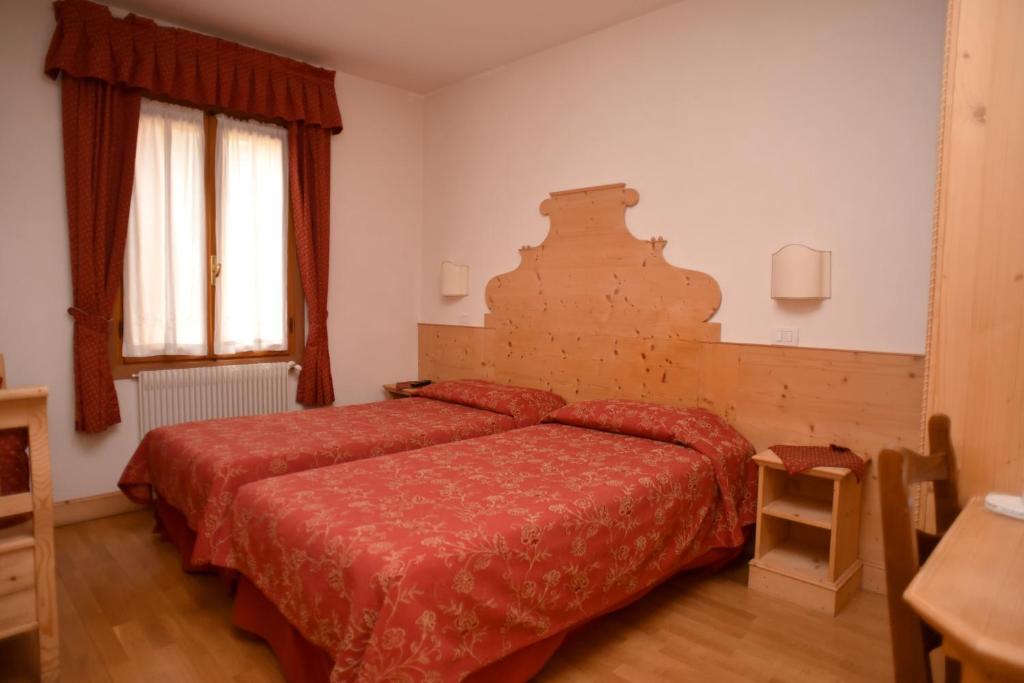Postel nebo postele na pokoji v ubytování Albergo Da Gildo