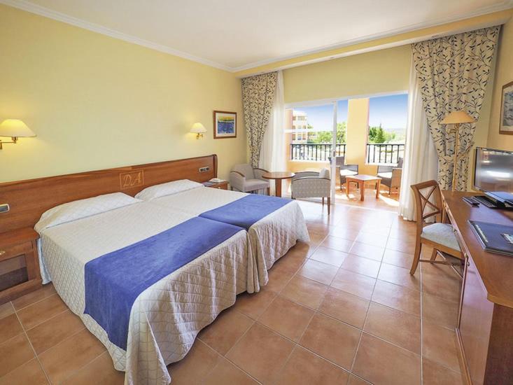 a hotel room with a bed and a balcony at Bordoy Don Antonio in Paguera