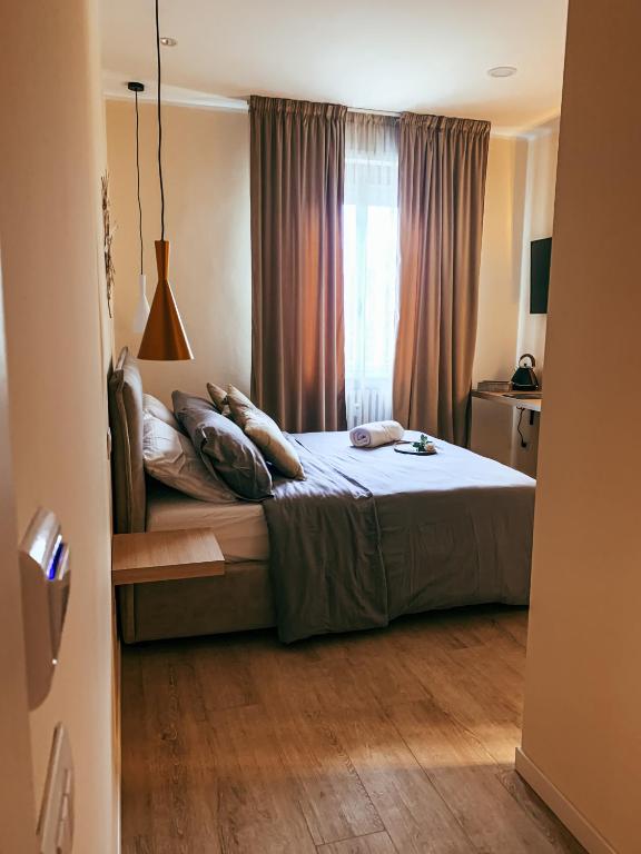 Posteľ alebo postele v izbe v ubytovaní B&B SALUS CIVICO 23