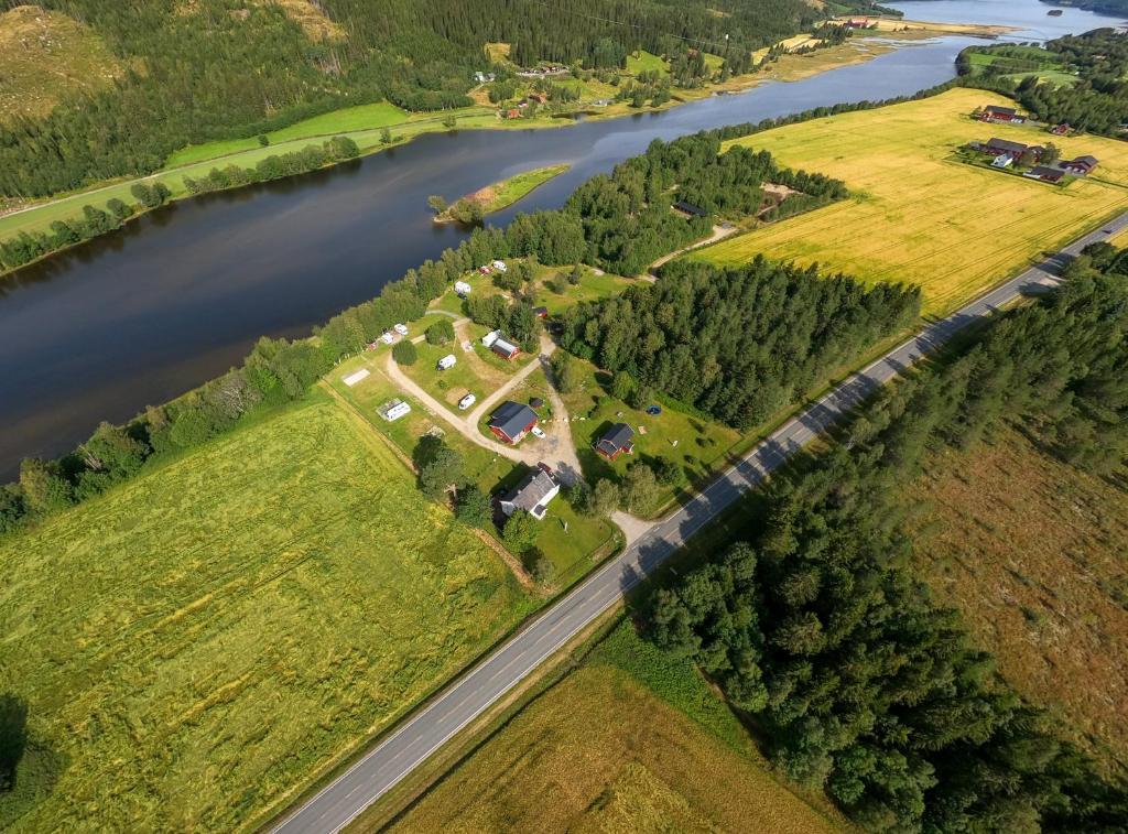 an aerial view of a house next to a river at Holmset Camping and Fishing in Namdalseid