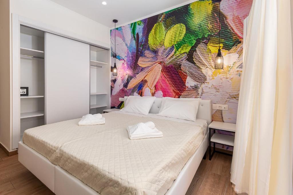 Postel nebo postele na pokoji v ubytování Aqua Luxury Suites by Estia