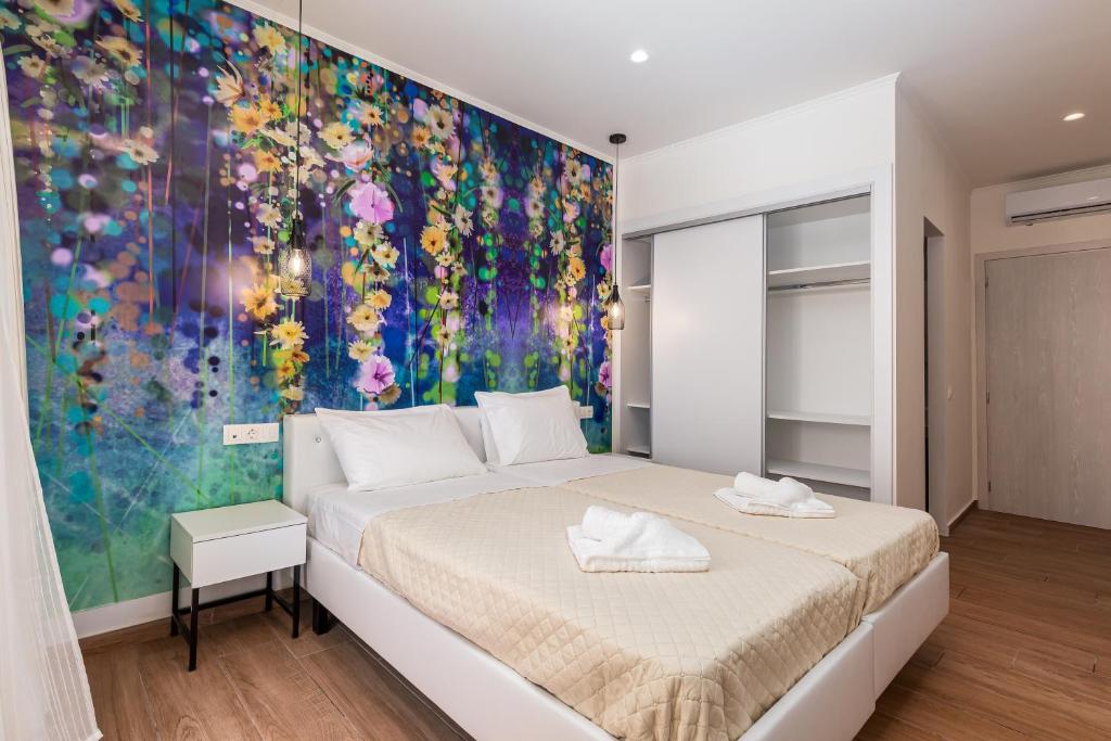 Postel nebo postele na pokoji v ubytování Aqua Luxury Suites by Estia