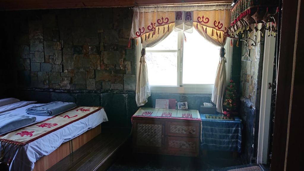 Postel nebo postele na pokoji v ubytování Wutai Dream-house