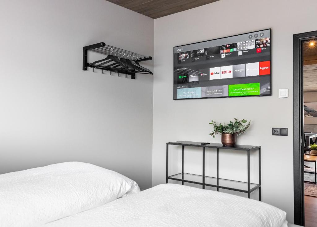 Postel nebo postele na pokoji v ubytování Pier Apartments