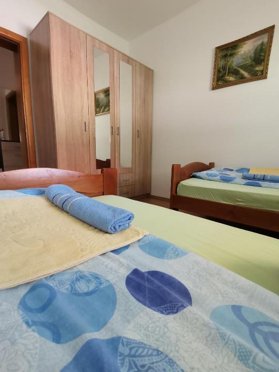 Postel nebo postele na pokoji v ubytování Apartment Osmajic