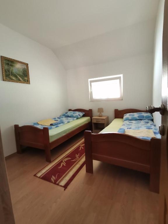 Postel nebo postele na pokoji v ubytování Apartment Osmajic