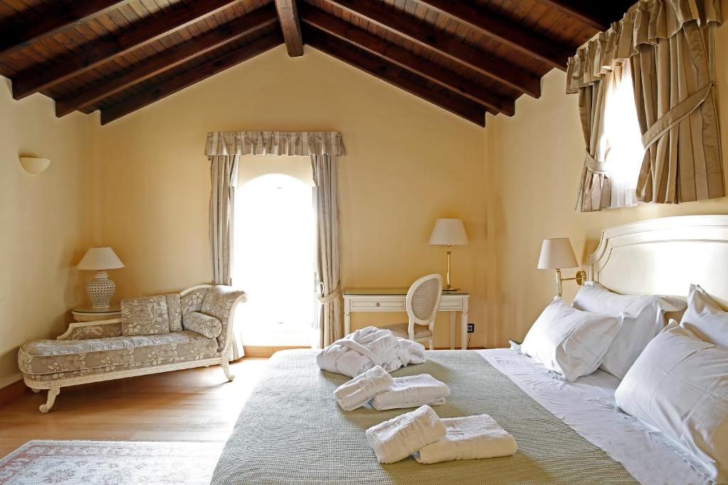 Postel nebo postele na pokoji v ubytování Siora Vittoria Boutique Hotel