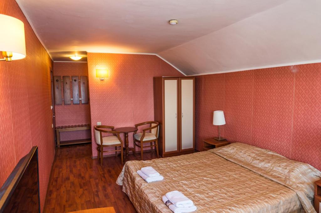 Postel nebo postele na pokoji v ubytování Aneli Hotel