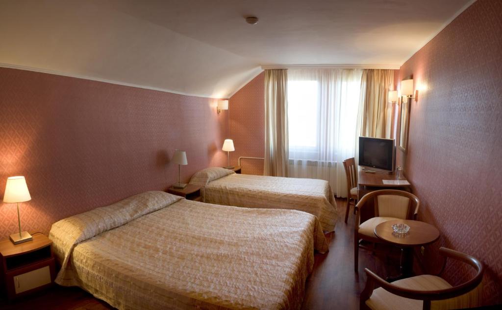 Postel nebo postele na pokoji v ubytování Aneli Hotel