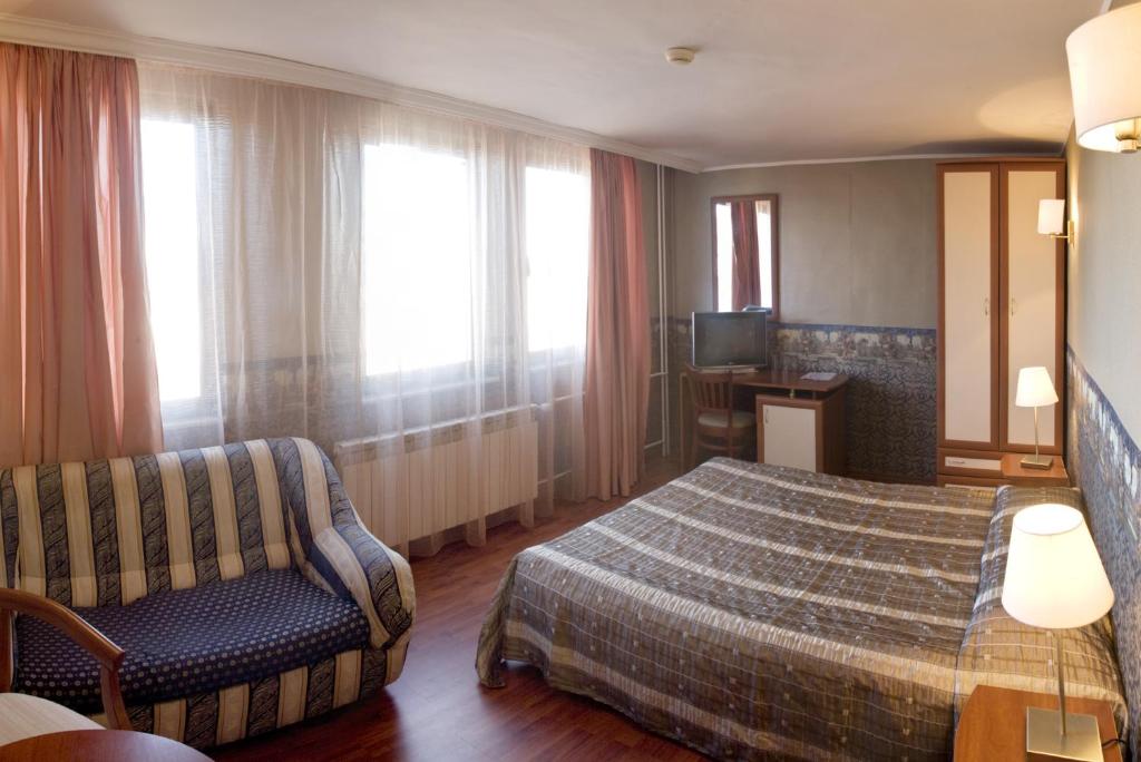 Postel nebo postele na pokoji v ubytování Aneli Hotel