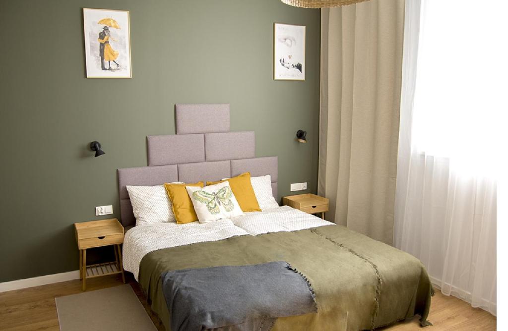 Posteľ alebo postele v izbe v ubytovaní Apartament na Jeziornej