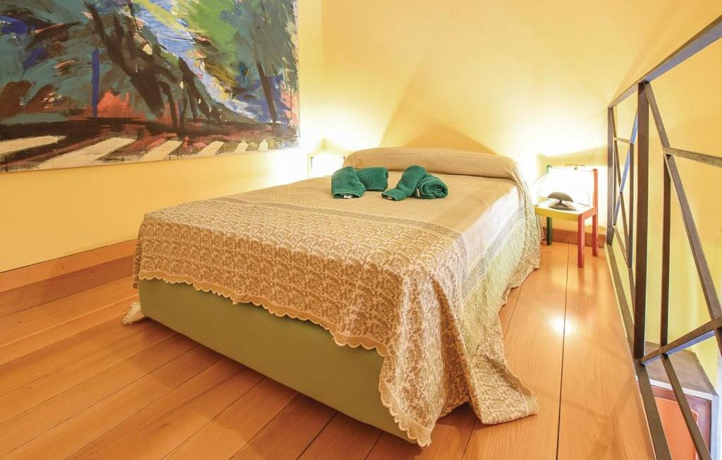 Posteľ alebo postele v izbe v ubytovaní Appartamenti Villa Ortensia