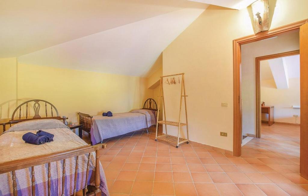Posteľ alebo postele v izbe v ubytovaní Appartamenti Villa Ortensia