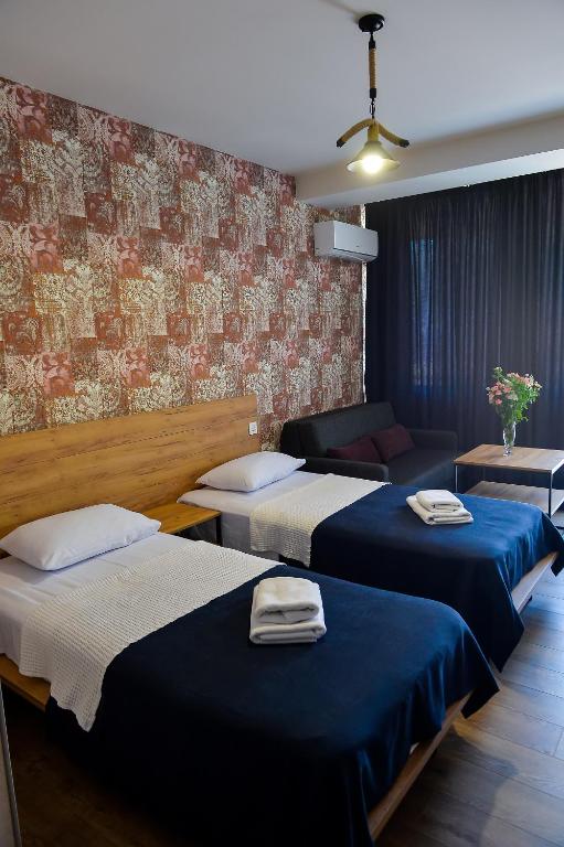 Postel nebo postele na pokoji v ubytování Tskaltubo Epic Hotel & Spa
