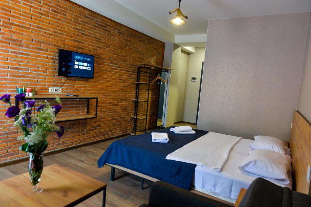 TV a/nebo společenská místnost v ubytování Tskaltubo Epic Hotel & Spa