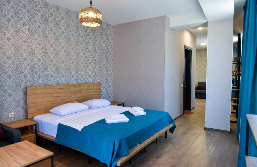 Postel nebo postele na pokoji v ubytování Tskaltubo Epic Hotel & Spa