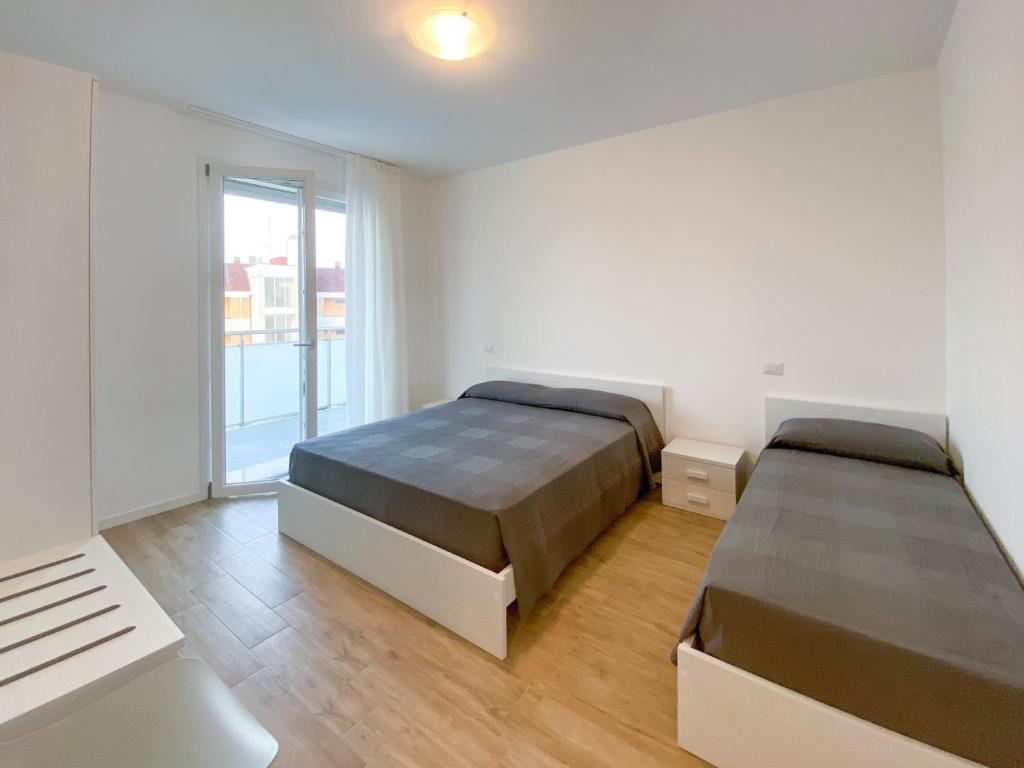 מיטה או מיטות בחדר ב-Residence Caorle