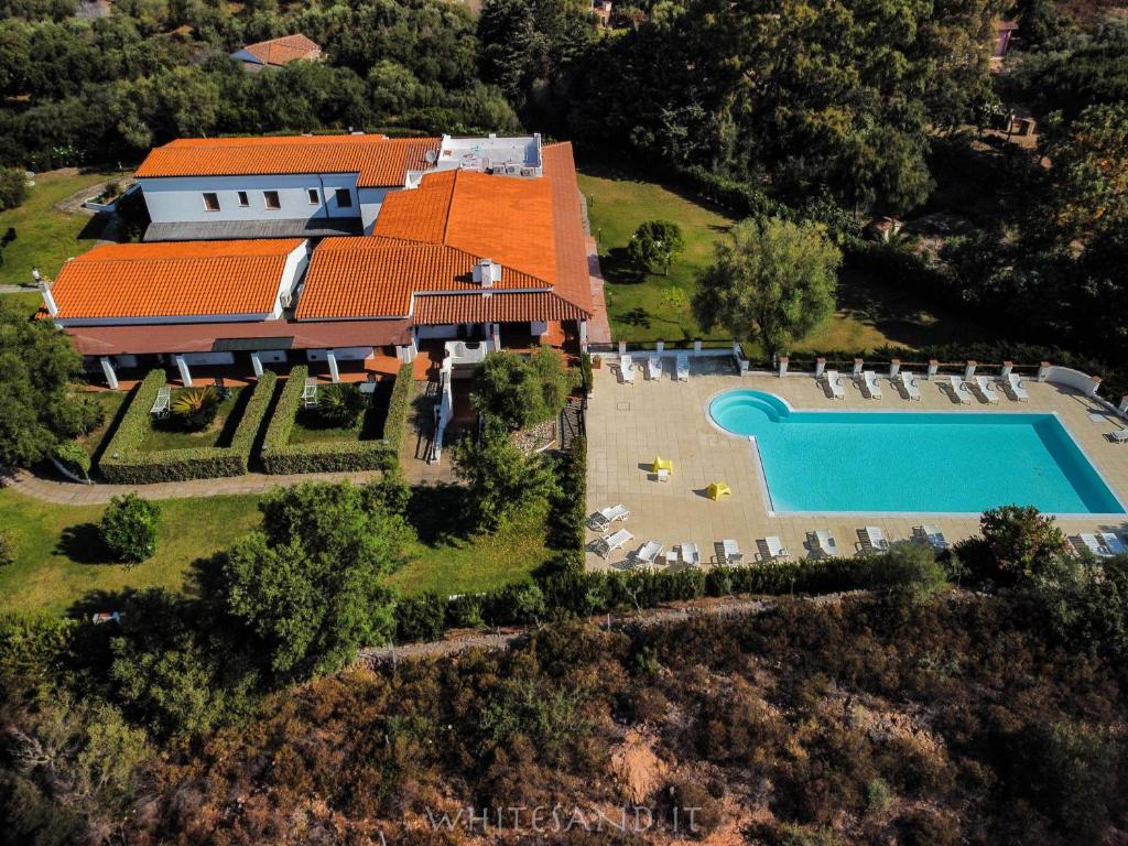 an aerial view of a house with a swimming pool at White Sand Residence in Murta Maria