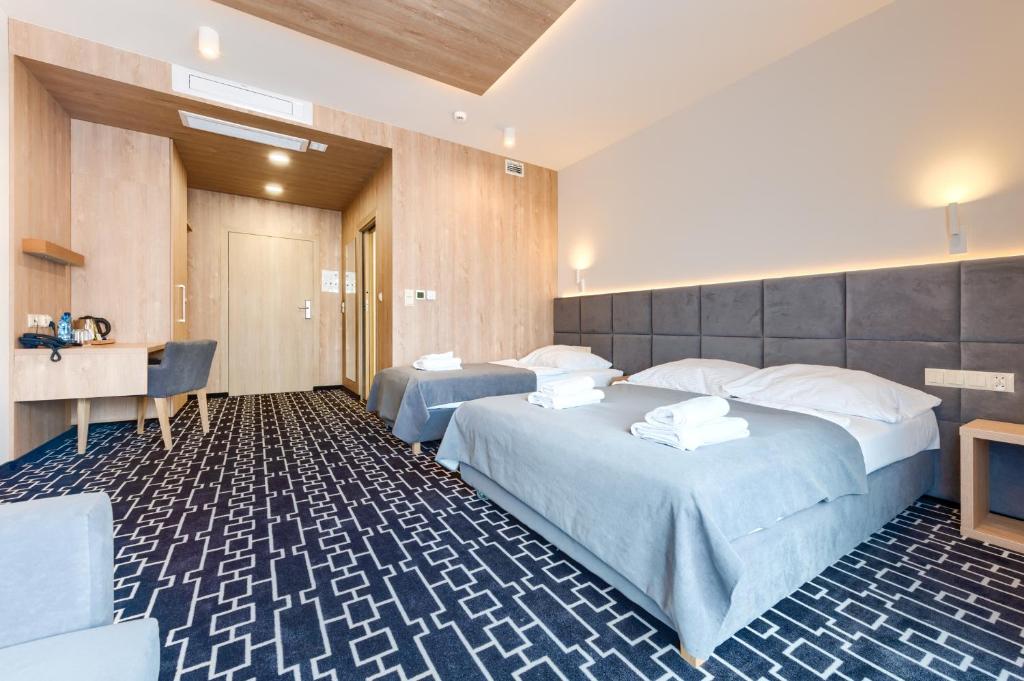 Postel nebo postele na pokoji v ubytování Hotel Wena