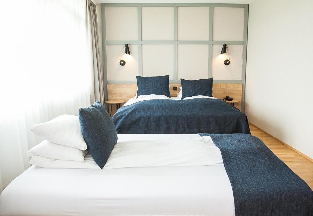 Postel nebo postele na pokoji v ubytování Fosshotel Reykholt