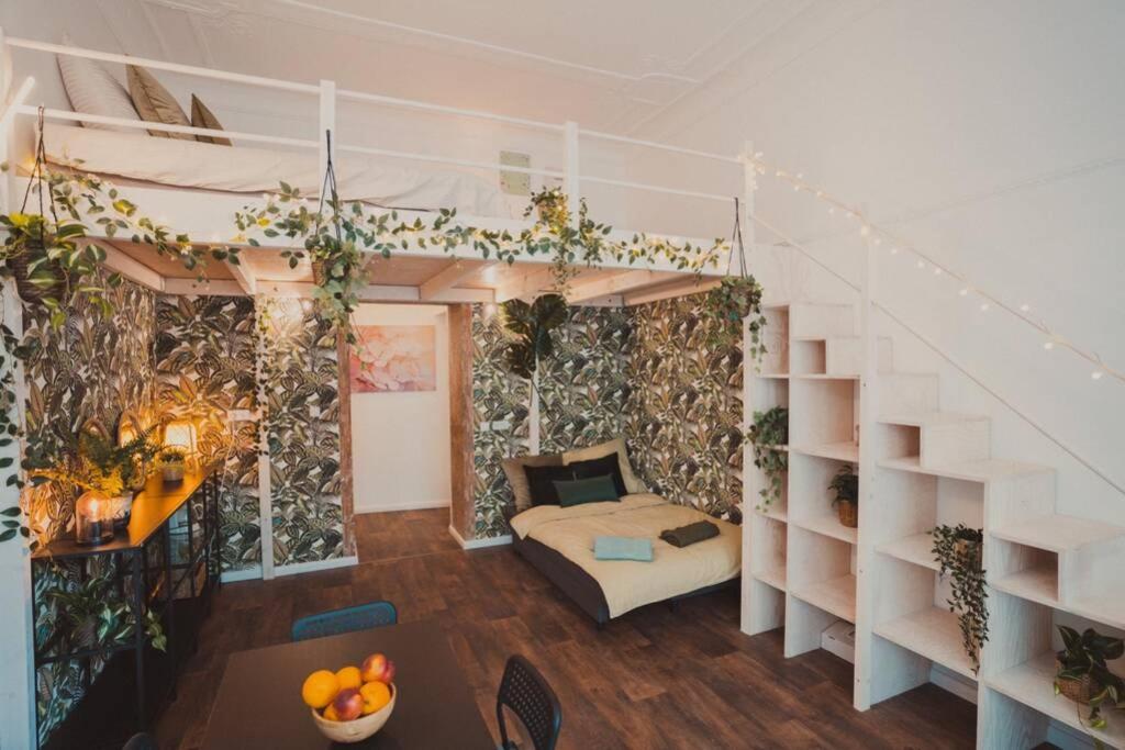 a room with a bunk bed and a staircase at City Home Ku'damm in Berlin