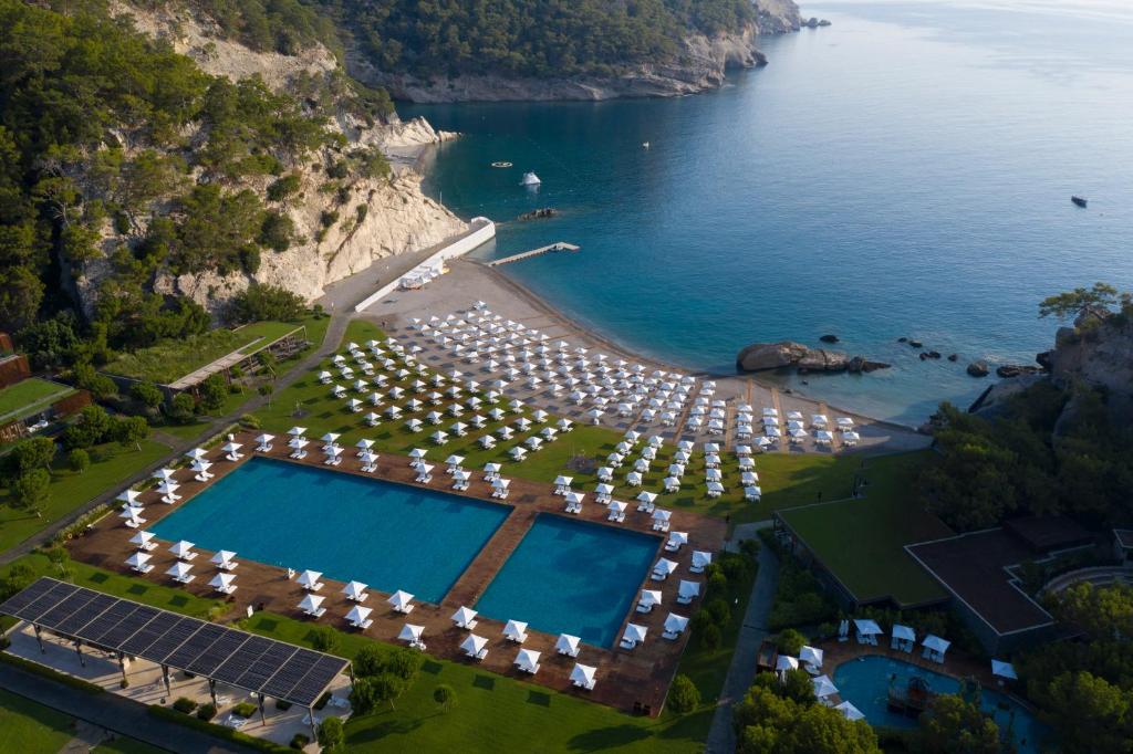 an aerial view of a resort with a swimming pool and the ocean at Maxx Royal Kemer Resort in Kemer