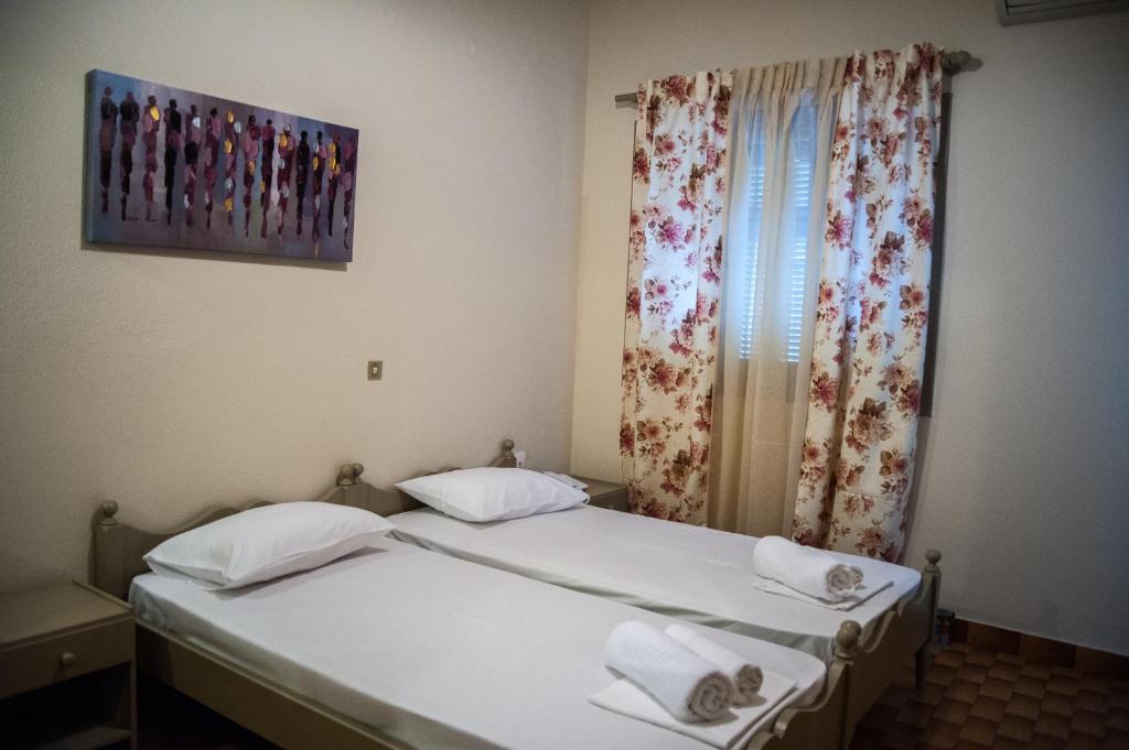 Postel nebo postele na pokoji v ubytování Argostoli Hotel