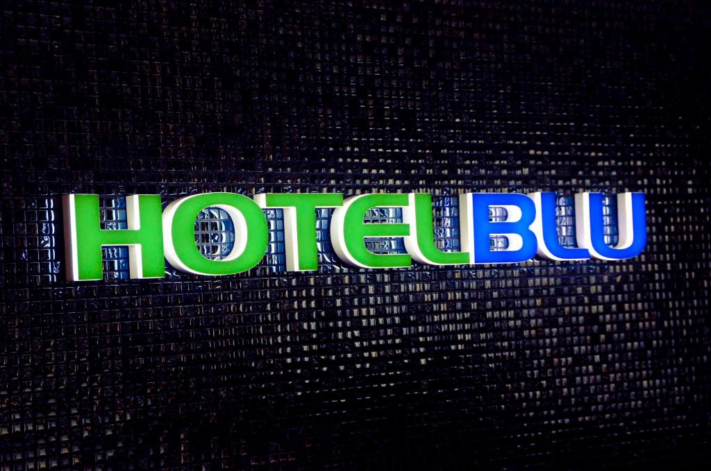 a sign that says hulu on a wall at Hotel BLU in Vancouver