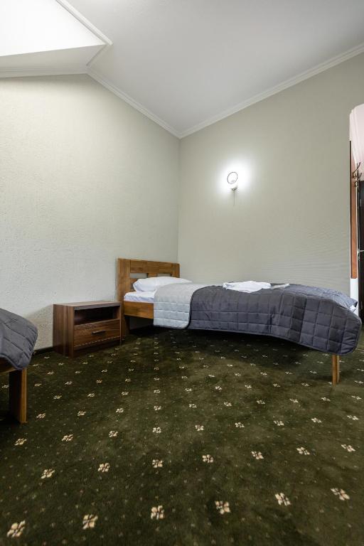 Postel nebo postele na pokoji v ubytování Аквамарин