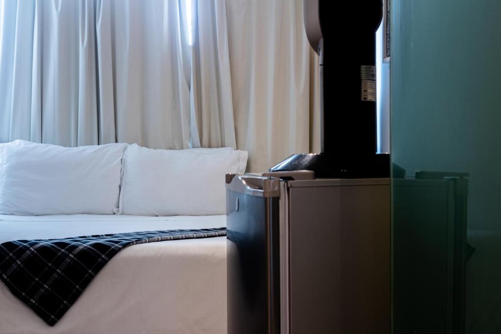 Postel nebo postele na pokoji v ubytování Kubo Hotel