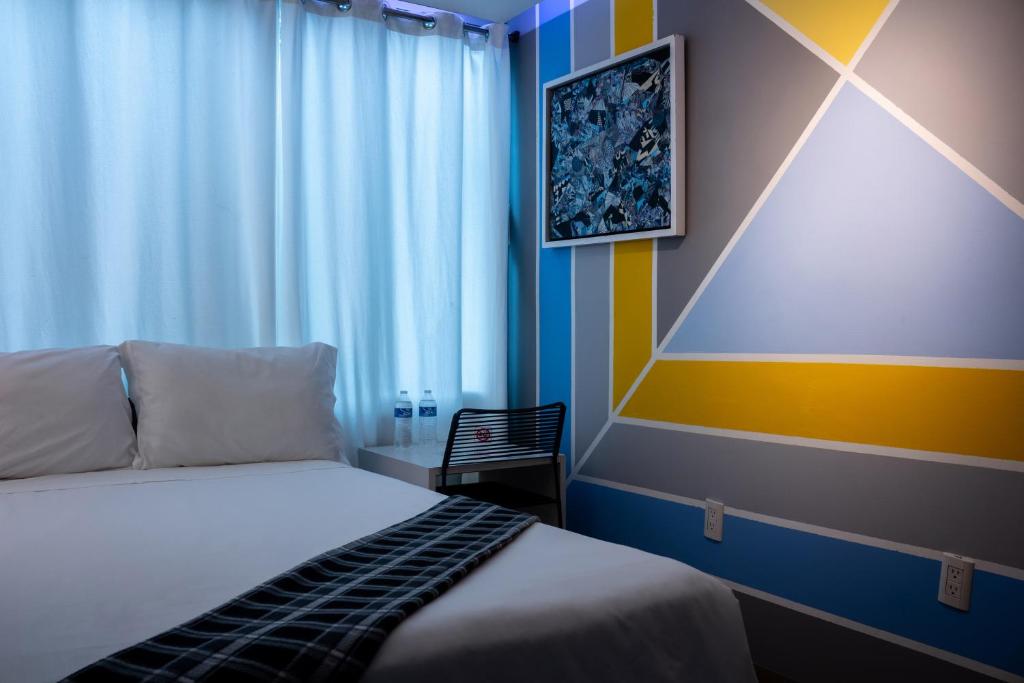 Postel nebo postele na pokoji v ubytování Kubo Hotel
