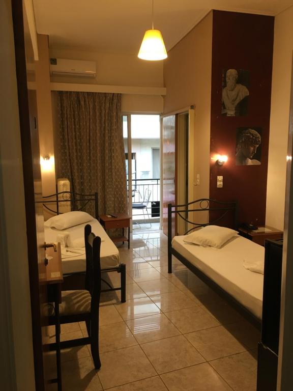 Postel nebo postele na pokoji v ubytování Hotel George