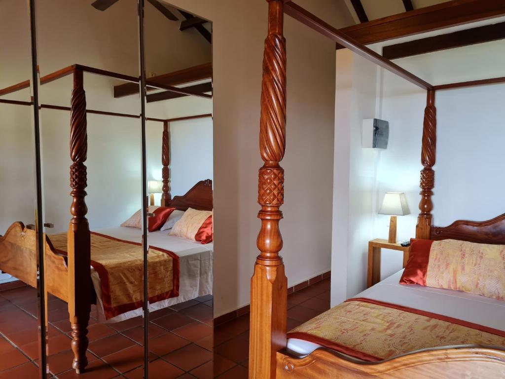 Postel nebo postele na pokoji v ubytování Chambre d'hotes "Villa Rayon Vert"