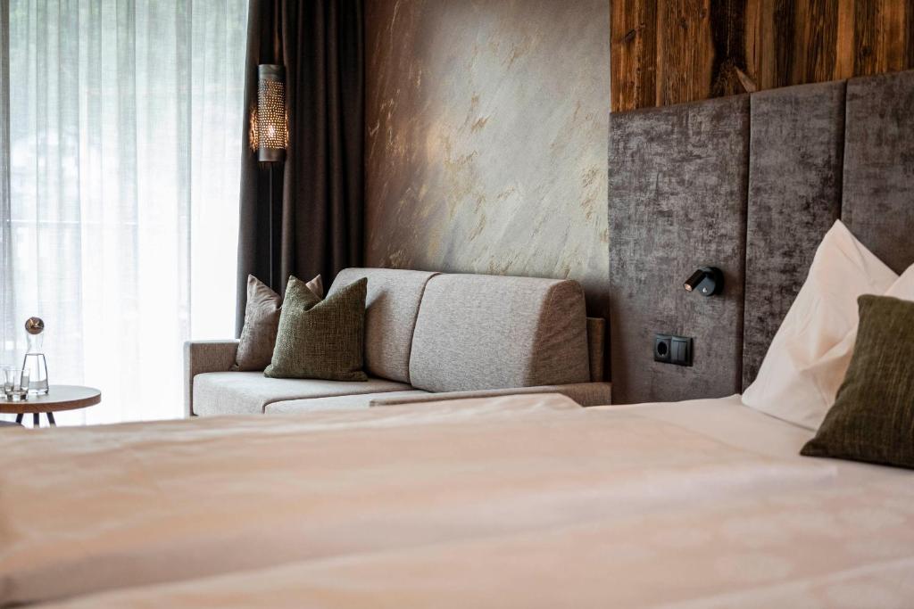 Postel nebo postele na pokoji v ubytování Hotel Klostersepp