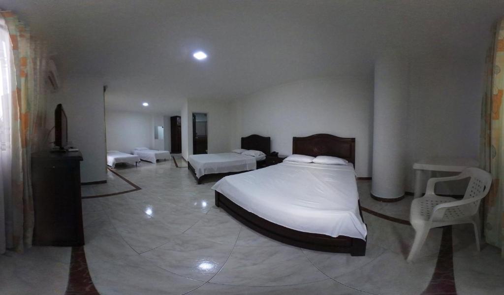 Postel nebo postele na pokoji v ubytování Zahira Hotel Melgar