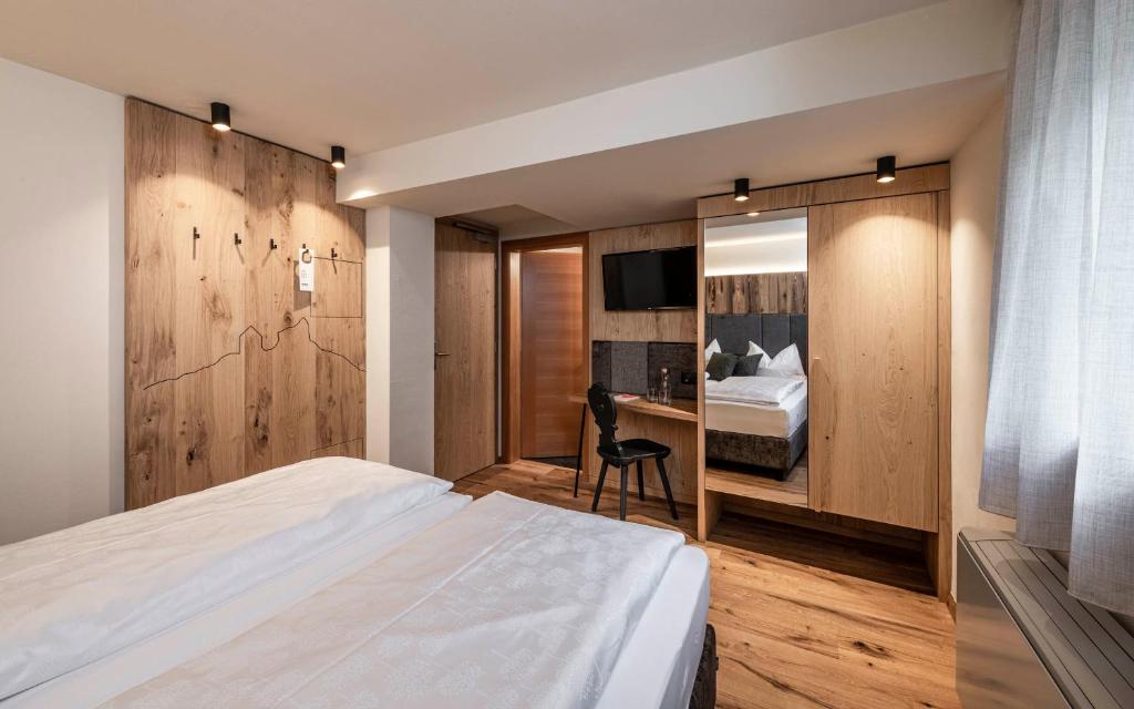Postel nebo postele na pokoji v ubytování Hotel Klostersepp