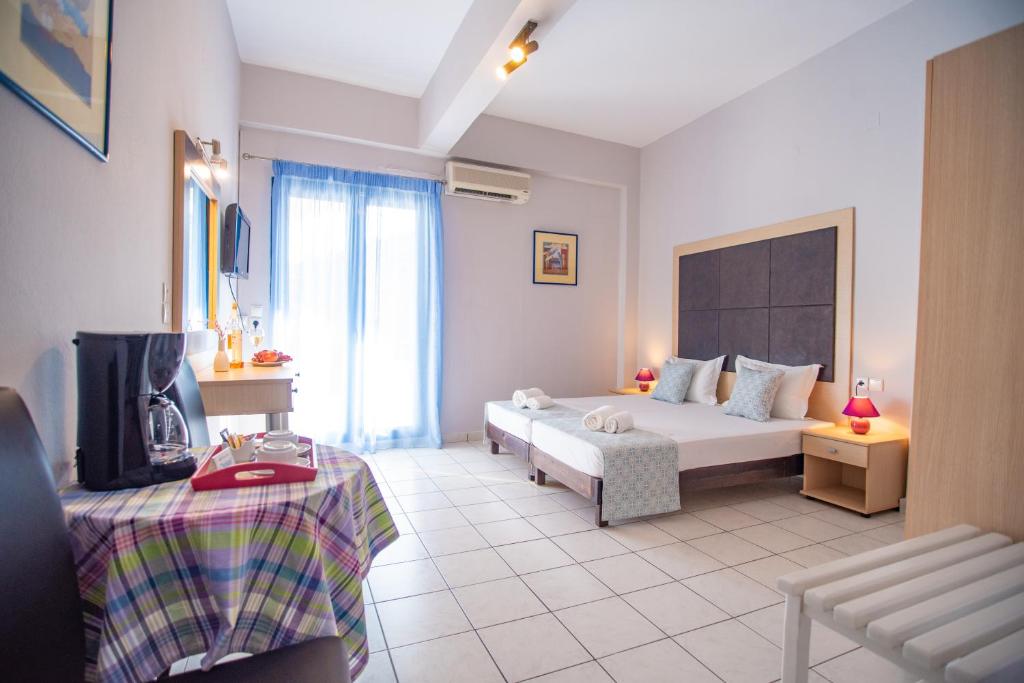 A bed or beds in a room at Christof Studios